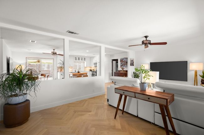 Living area featuring ceiling fan, recessed lighting, visible vents, and baseboards | Image 9