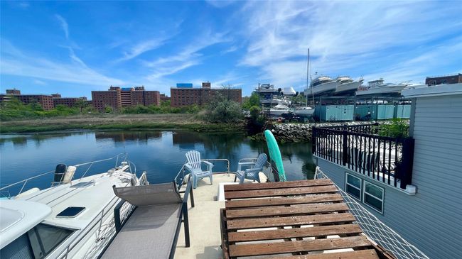 Dock area featuring a water view | Image 17