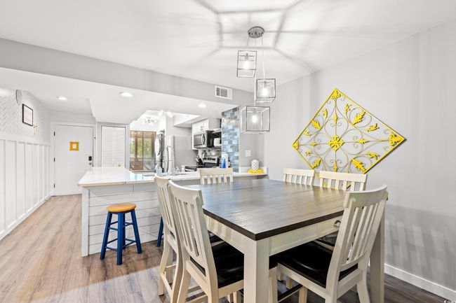 Dining room featuring wood finished floors and baseboards | Image 9