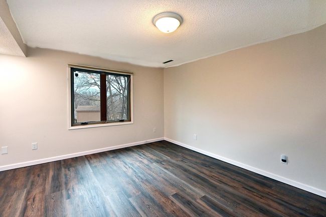 Freshly Painted 4th Bedroom on Third Level Features new LVP Flooring! | Image 16