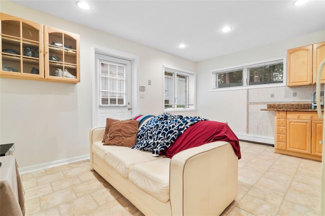 Living room featuring baseboards, recessed lighting, and a baseboard radiator | Image 41