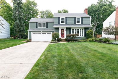 View of front of property with a garage and a front yard | Image 1