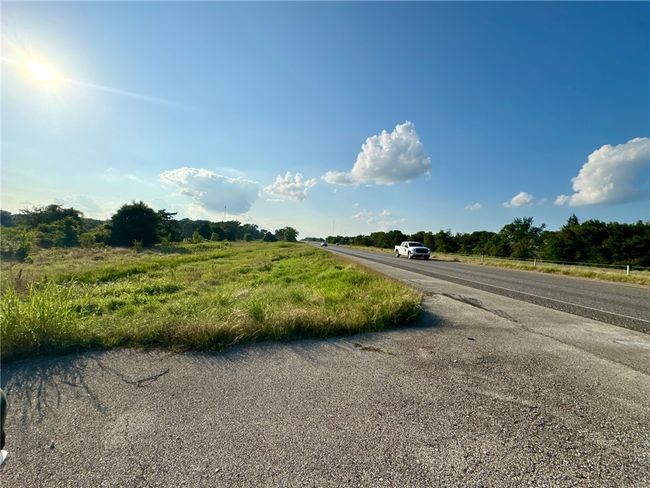 View of asphalt street featuring a view of countryside | Image 18
