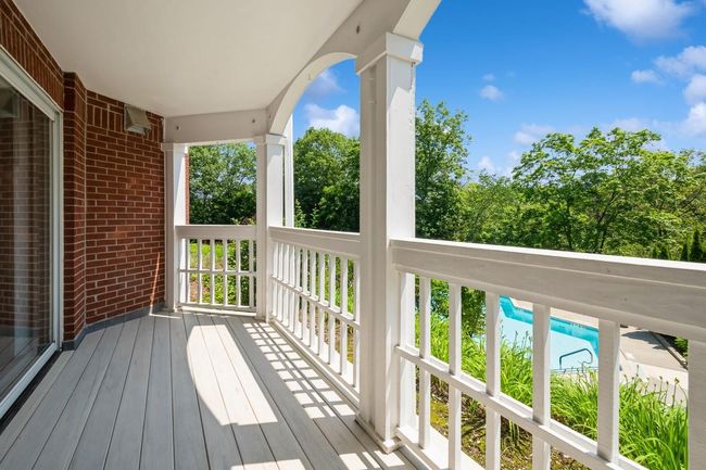 View of large private trex deck overlooking pool | Image 17