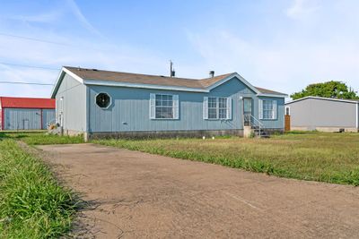 Manufactured / mobile home with a front yard | Image 3