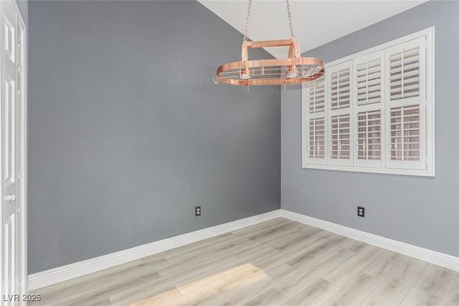 Dining area with copper pot rack | Image 14