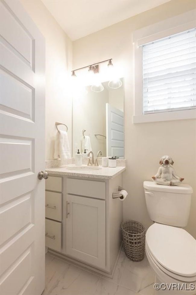 Bathroom with marble finish flooring and vanity | Image 11