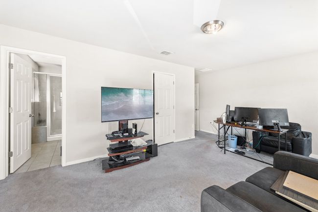 Primary bedroom currently being used as an office. | Image 14