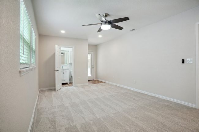 Cozy and spacious with plush carpet, recessed lighting, and natural light | Image 12