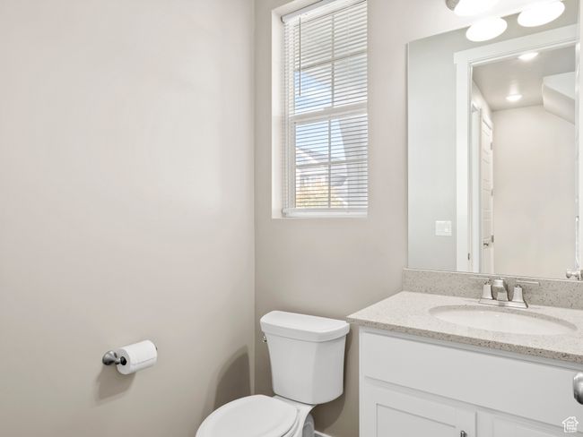 Bathroom with toilet and vanity | Image 4