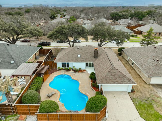 View of swimming pool with a fenced backyard and a residential view | Image 26