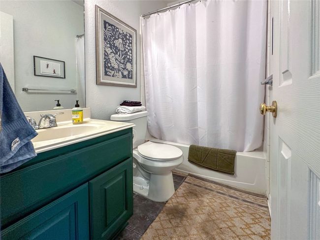 Full bath featuring vanity and shower / tub combo with curtain | Image 18