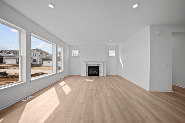 The living room is complete with gas fireplace. | Image 5