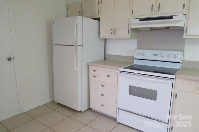 Left side of kitchen - refrigerator does convey | Image 20