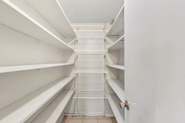 Spacious walk-in pantry for all your storage needs. | Image 15