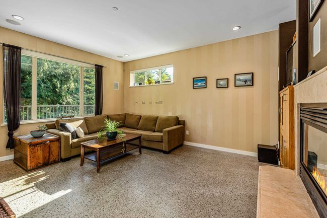 Living room with speckle patterned floor and recessed lighting | Image 5