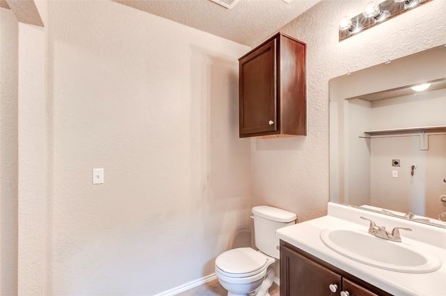Bathroom with vanity and a textured ceiling | Image 10