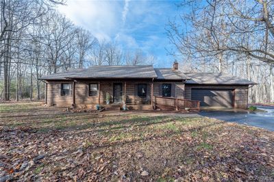 View of front of house with a garage | Image 1