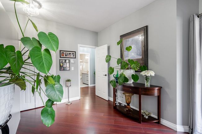 Corridor featuring baseboards and wood finished floors | Image 21
