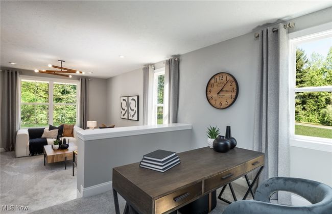 Spacious two-tiered office with casual living area. | Image 6