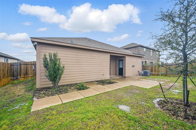 Back of house with a fenced backyard, a patio, and a lawn | Image 20