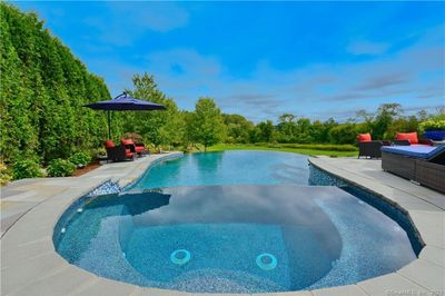 Spa and pool are finished with luxurious Pebble Tec Glass Blend. | Image 3