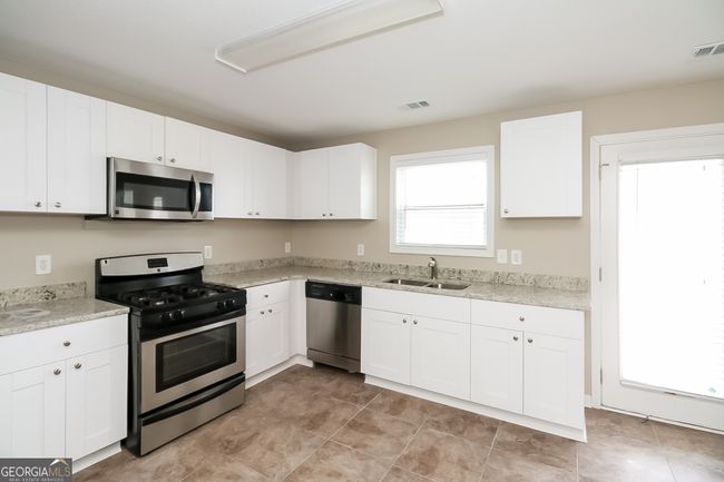 7144 Caspian Dr, House other with 7 bedrooms, 3 bathrooms and null parking in Fairburn GA | Image 6