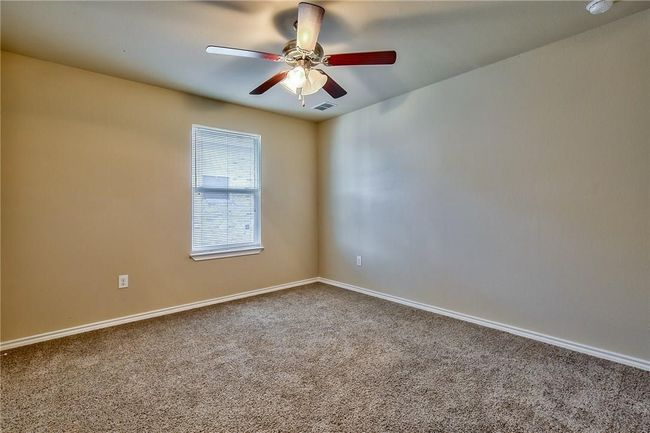 Unfurnished room with carpet and a ceiling fan | Image 7