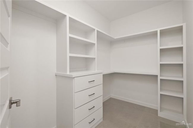 View of walk in closet | Image 10