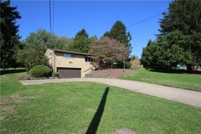 Beautiful Brick Ranch on Over 1 ACRE in Very Desirable Country Location offering Plenty of additional Off Street Parking plus Oversized 2 Car Garage | Image 1