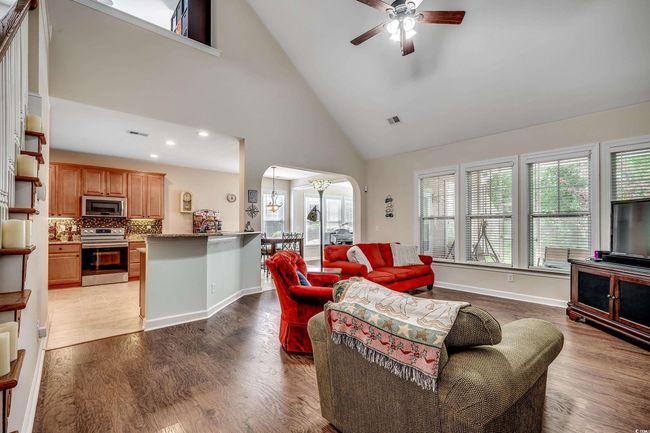 Two story ceiling, arches, ceiling fan and lvp floors | Image 12