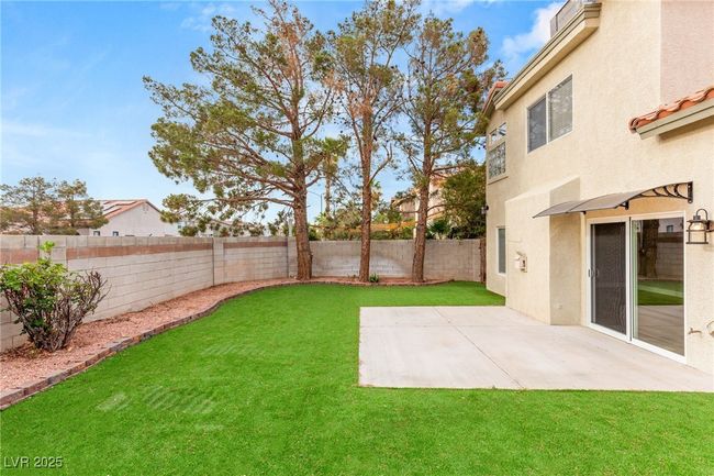 View of yard with a patio and a fenced backyard | Image 4