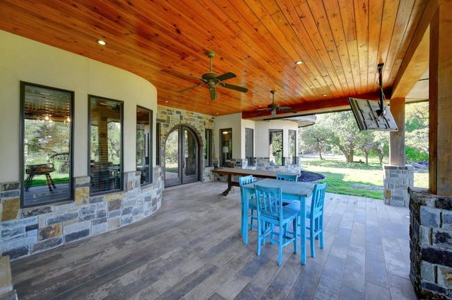 View of patio / terrace with outdoor dining area and ceiling fan | Image 34