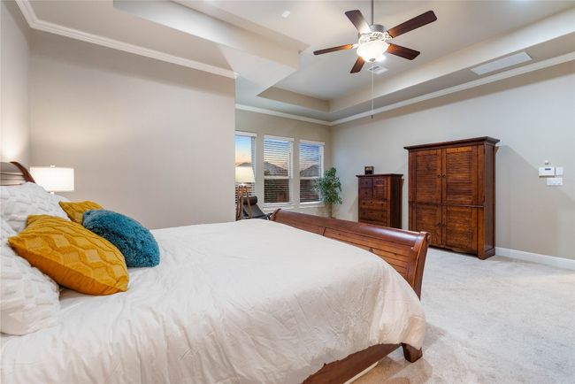 Large Primary Bedroom with Seating Area and Tray Ceilings | Image 21