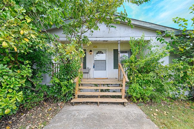 View of exterior entry featuring a porch | Image 31