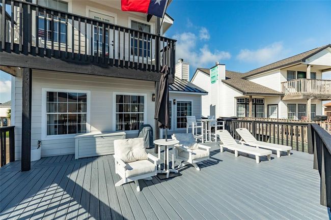 Large back deck has plenty of room for multiple seating areas | Image 19