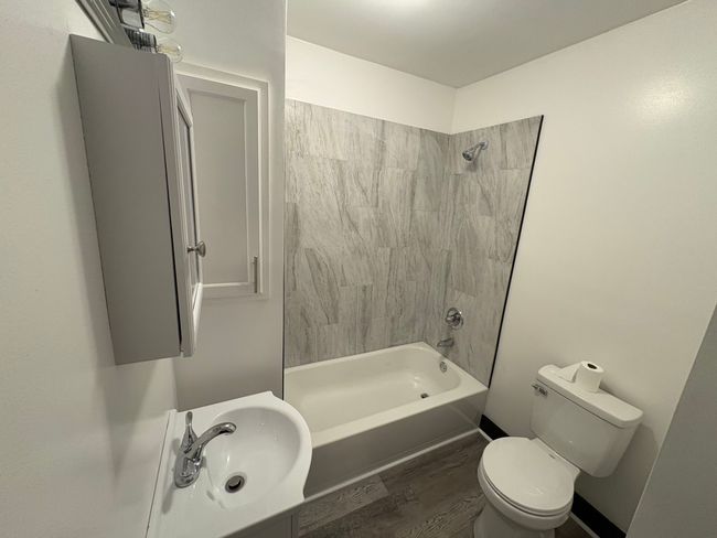 Renovated Bathroom with Tile Surround | Image 9