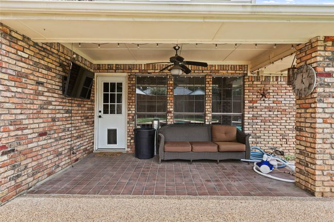 View of patio / terrace with a ceiling fan | Image 30