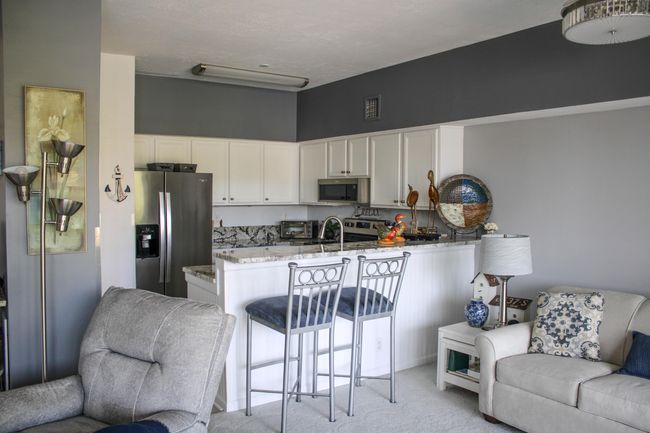 remodeled kitchen with granite countertops. | Image 7
