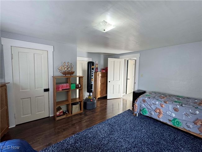 Bedroom with wood finished floors | Image 27