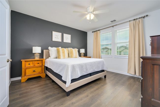 Bedroom featuring dark wood-style flooring and ceiling fan | Image 8