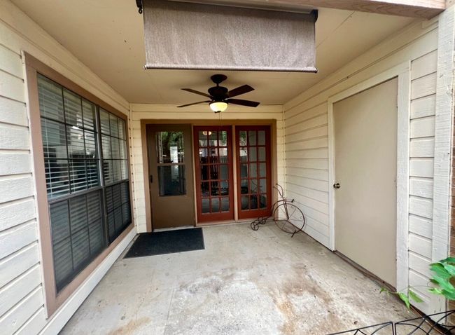 View of exterior entry featuring a ceiling fan and french doors | Image 21