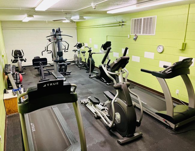 Workout room with a variety of equipment | Image 21