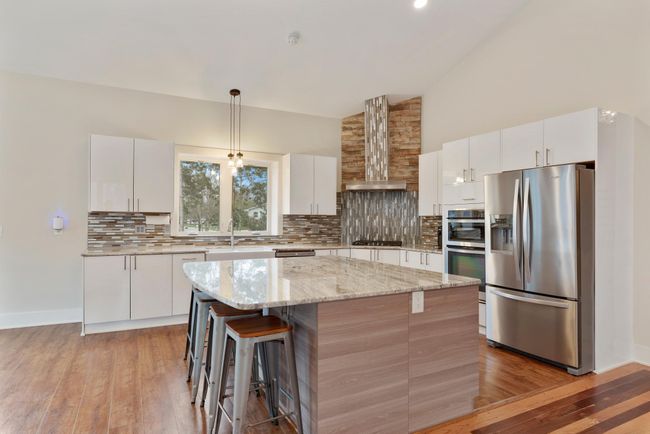 The kitchen speaks for itself with top of the line finishes all around including the double wide island with extra storage and no shortage of granite counter space | Image 11
