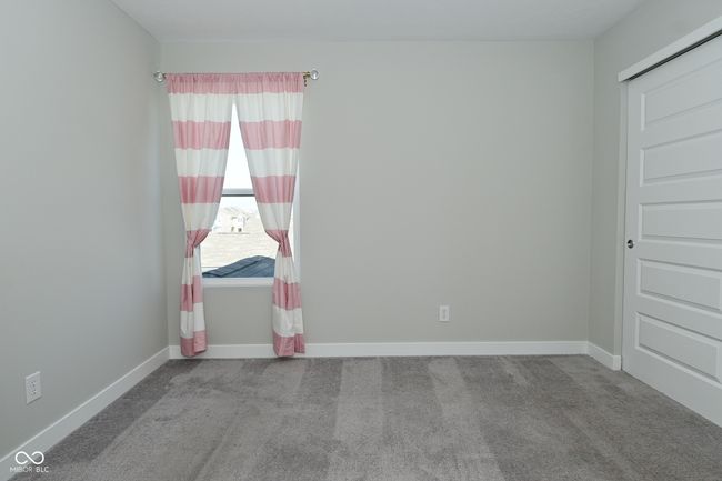 carpeted spare room with baseboards | Image 36
