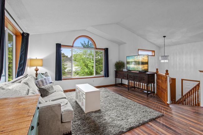 The living room has plenty of space for seating and to display your large furniture. | Image 4
