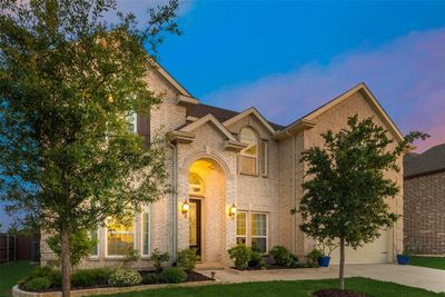 View of front facade with a garage | Image 1