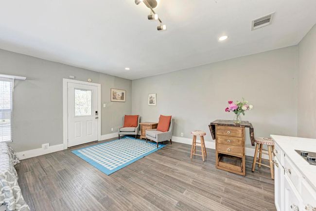 Living area with visible vents, recessed lighting, baseboards, and light wood-style floors | Image 32