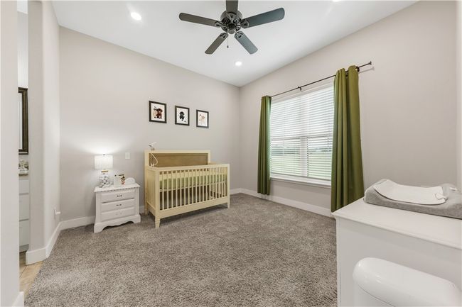 Bedroom with baseboards, carpet, ceiling fan, and recessed lighting | Image 18