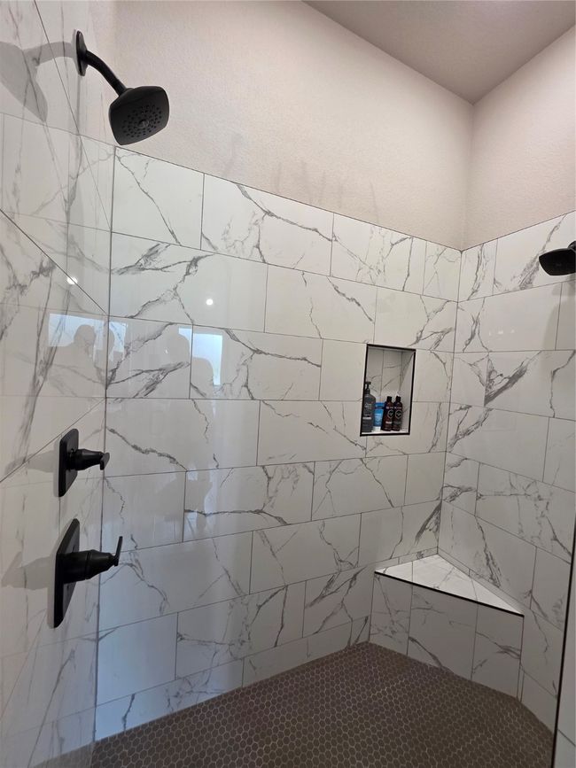Bathroom featuring tiled shower | Image 26